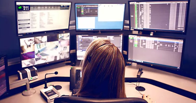 Telecommunications workers at a screen